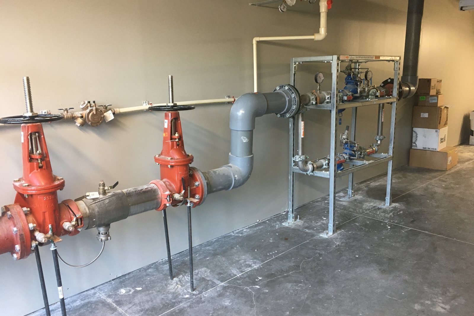 Mechanical room at The James, backflow prevention and pressure-reducing valve station